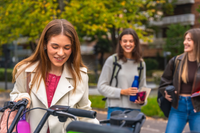 Woman smiling parking a bike