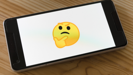 a puzzled emoji icon on a smart phone screen